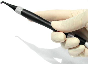 Hand-held laser examination tool